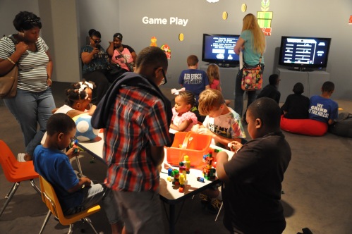 Families in the interactive gallery during a Wacky Wednesday event. 